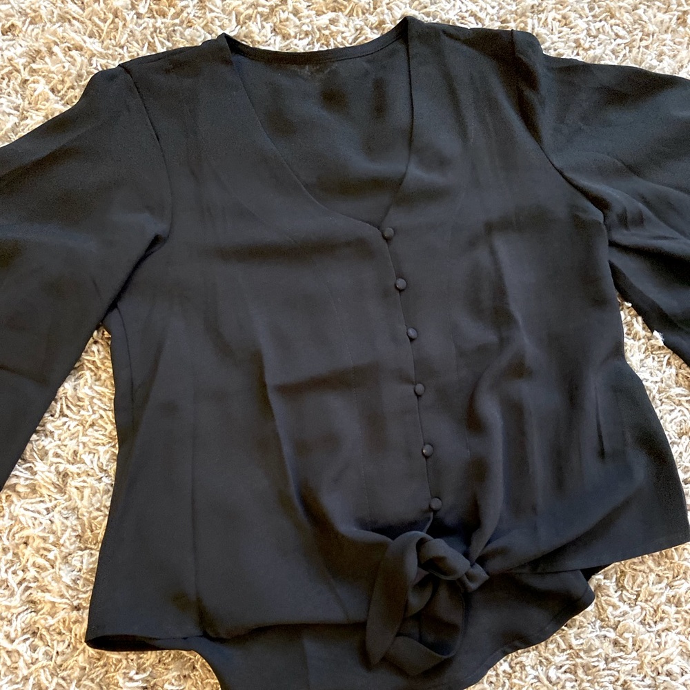 Black blouse, tie waist and covered buttons. Never worn!